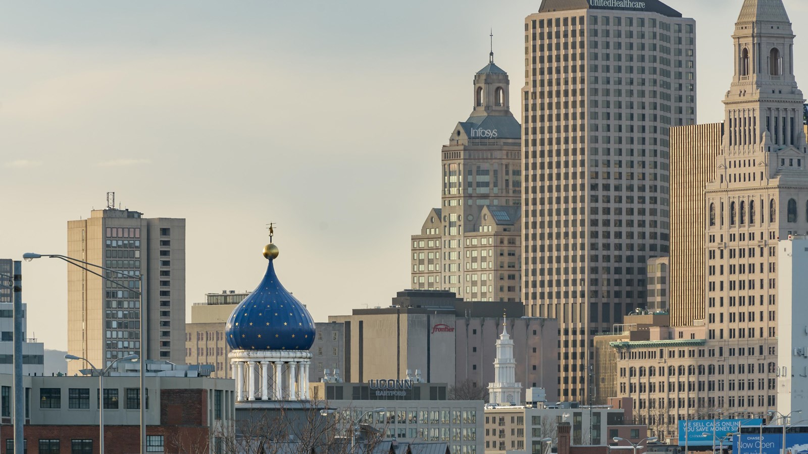 The blue onion dome with rampant colt against a city skyline. 