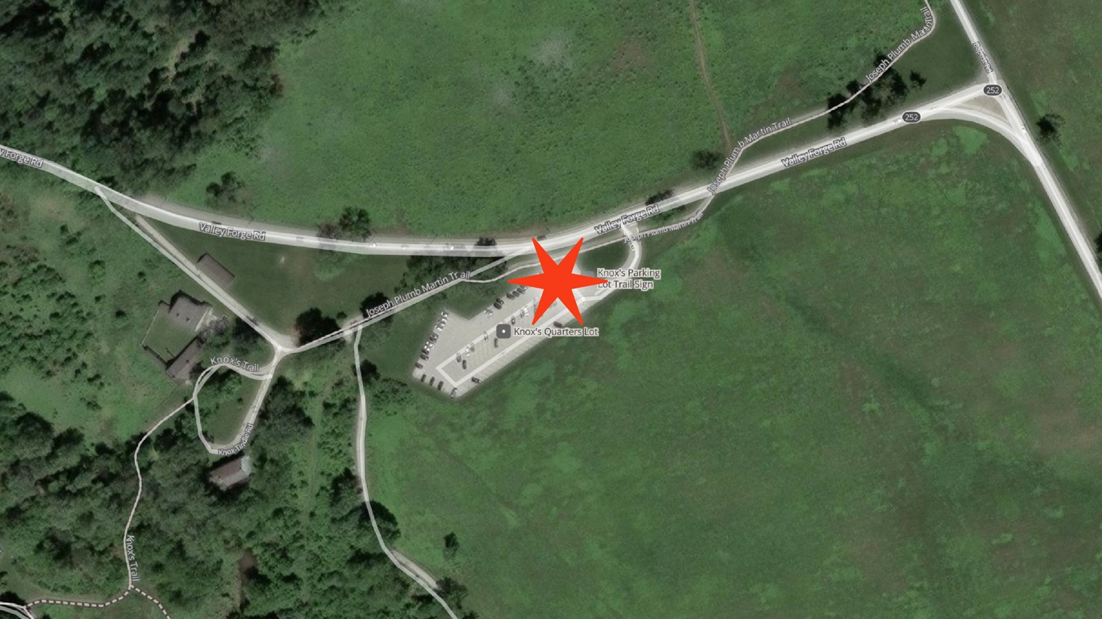 Aerial view of Knoxs Quarters area with star in parking lot marking pick up drop off location
