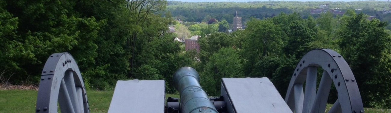The replica cannon overlooks the town of Morristown from Fort Nonsense.