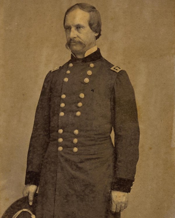 A sepia portrait of a man in Civil War era military uniform. 