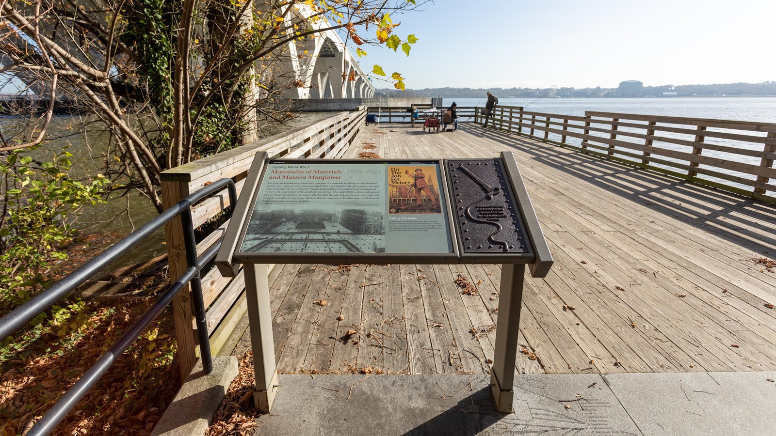 A black and white image of a concrete ship yard in early stage build is displayed.