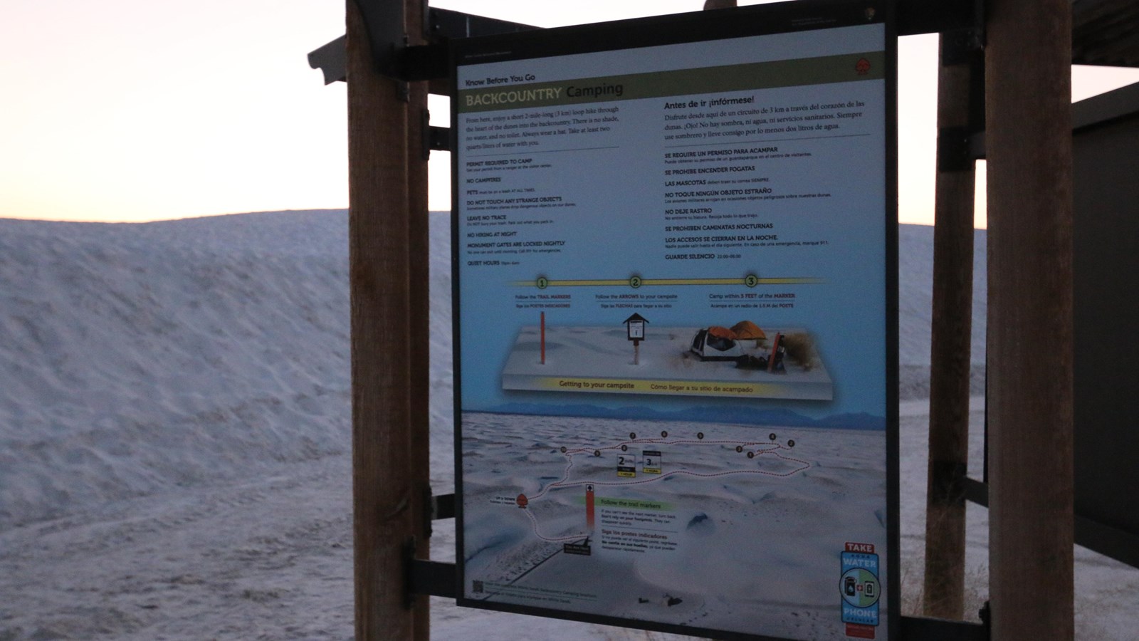 The Backcountry Camping kiosk panel at sunset.