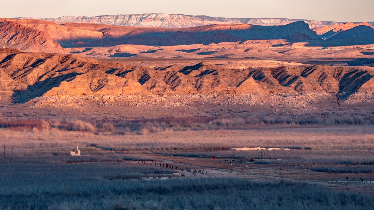 Old historic buildings left in a desert landscape.