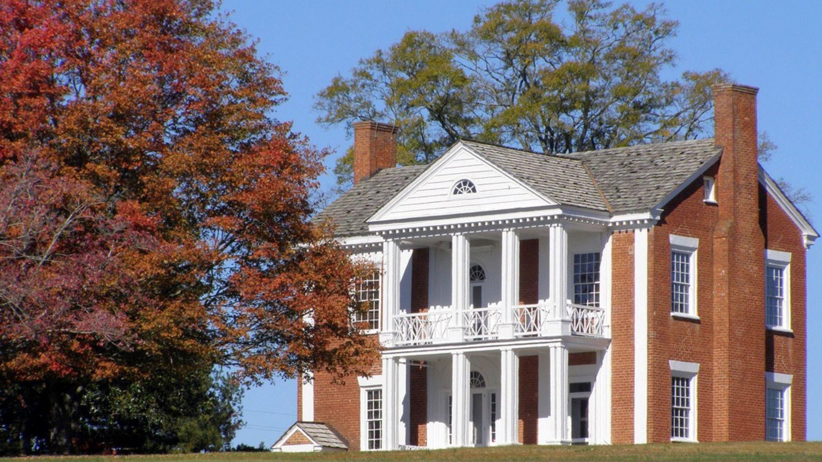 Exterior Brick and white column two story mansion, Plantation downed by James Vann of Cherokee Ntn