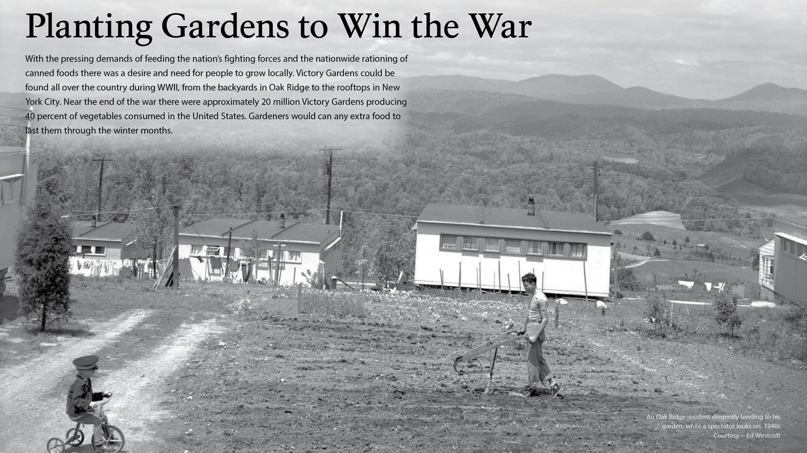 A wayside with text and an image of a man tilling a garden.