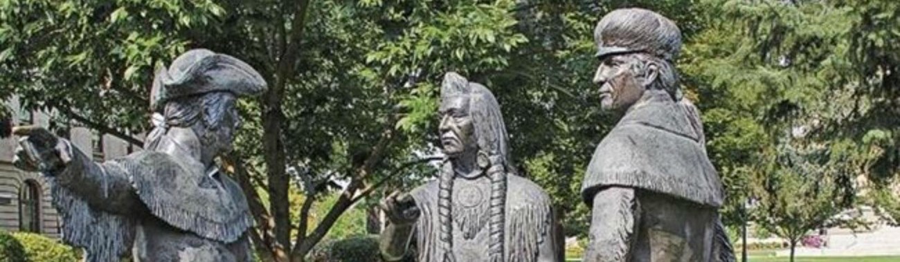 large statue with several men