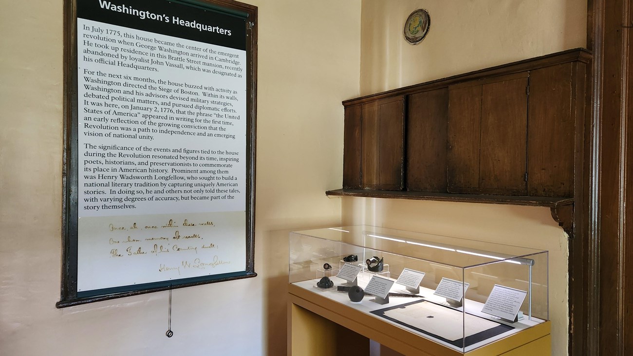 Exhibit case and label banner in historic house space