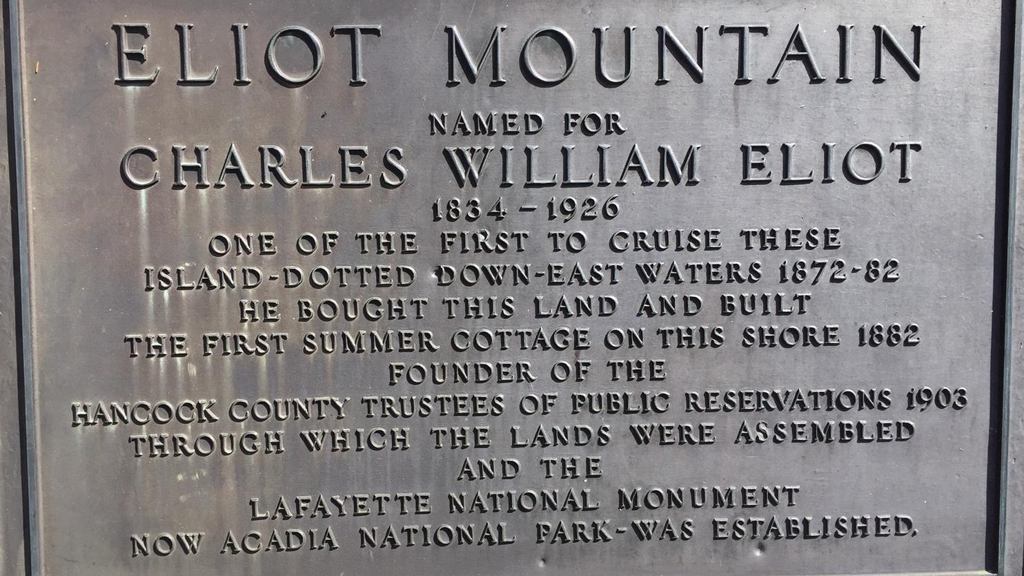 Bronze plaque on granite, raised inscription dedicated to Charles W. Eliot.