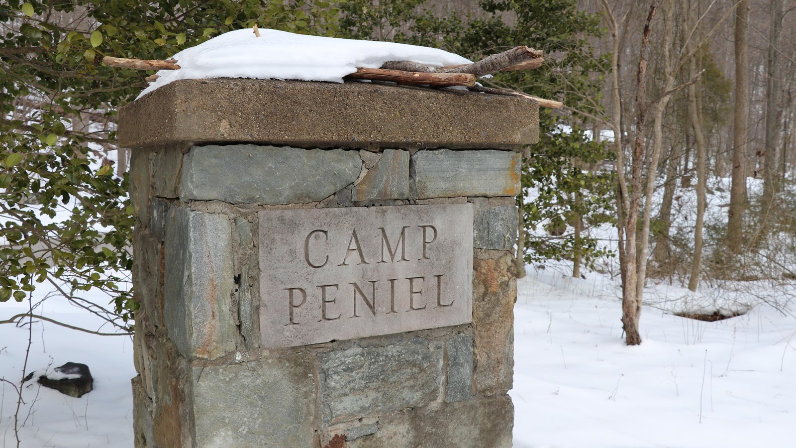 A stone pillar with the words 