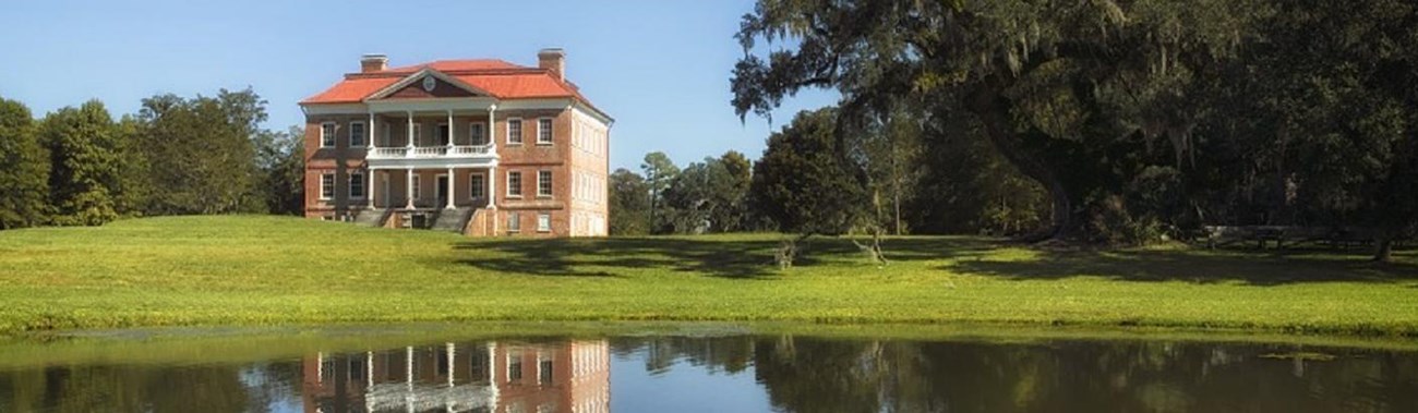 Colored photo of Drayton Hall and grounds. 