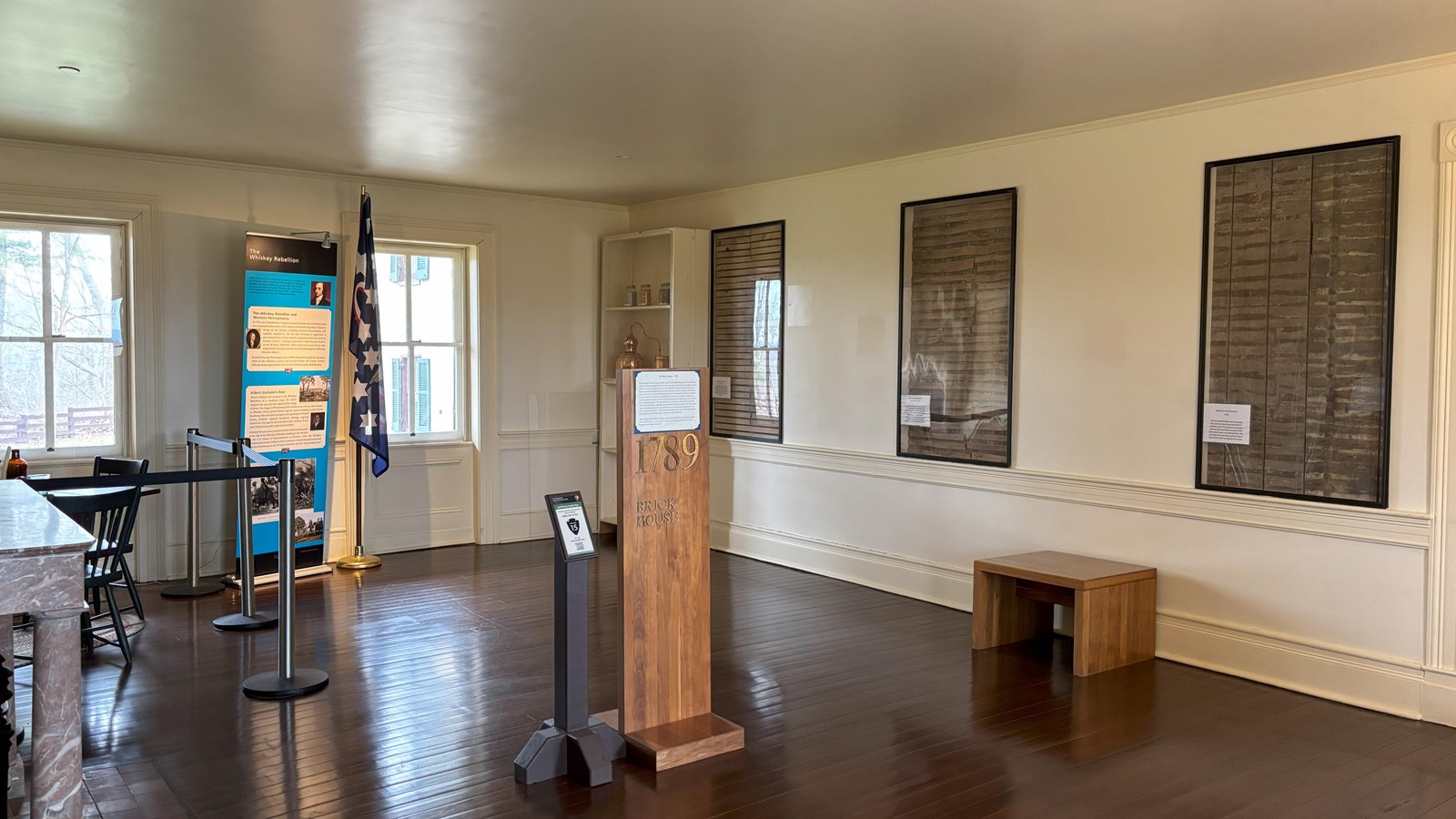 A large open rectangular room with some displays around the perimeter