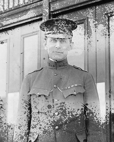 black and white image of a man in an old style military uniform