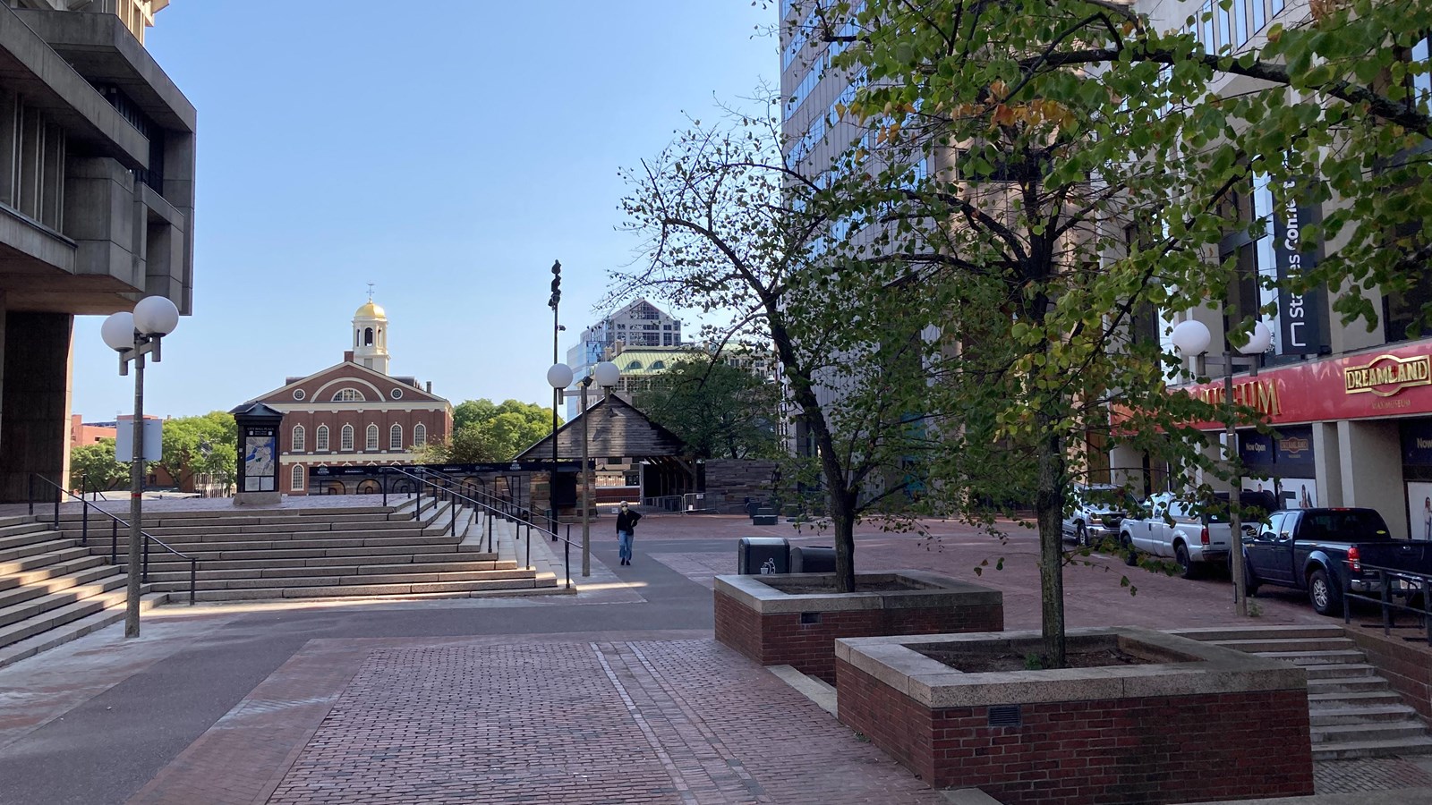 Open space at Government Center with Faneuil Hall in the distance and buildings to the right.