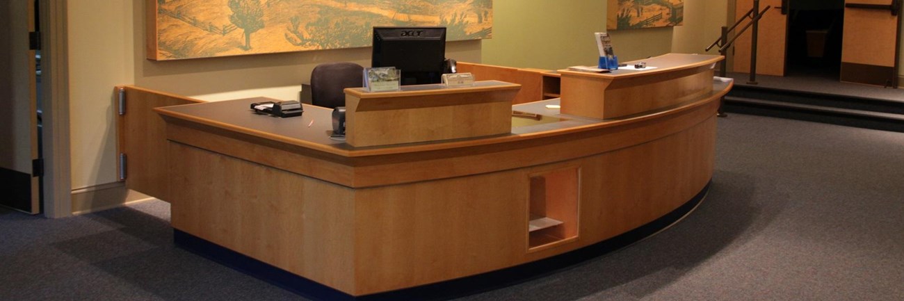 building interior with yellow walls and blue carpeting. 