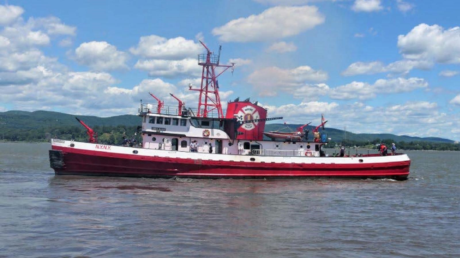 Red and white fireboat on the water