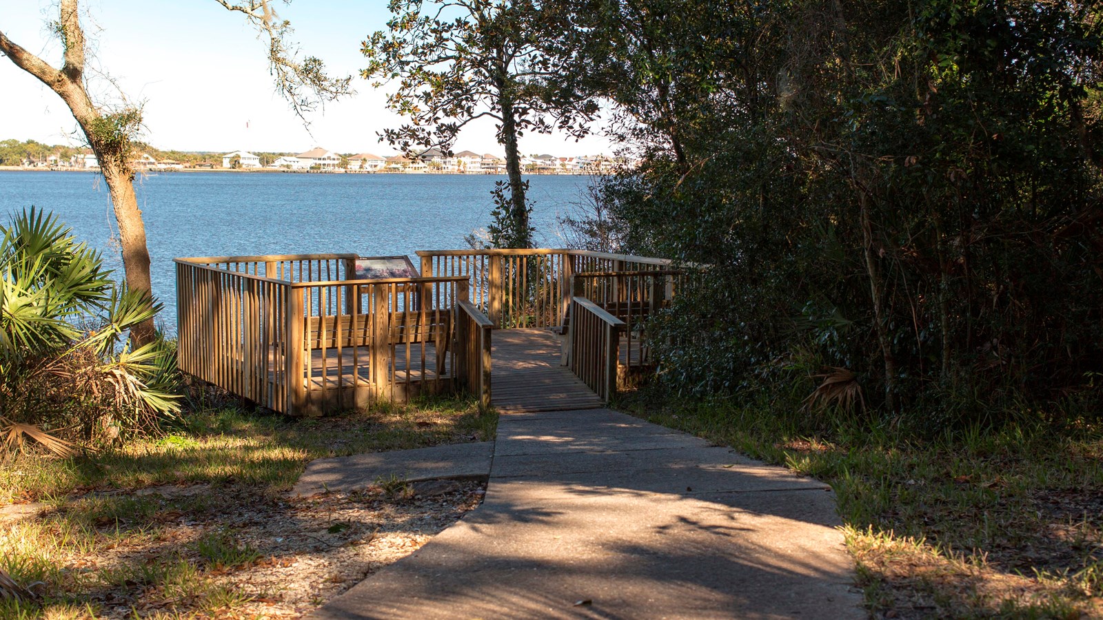 a wooden deck on the rivers edge