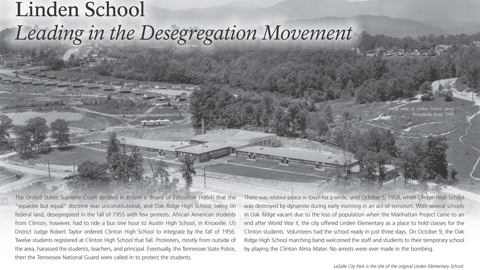 A wayside exhibit with text and an aerial photo of an elementary school.