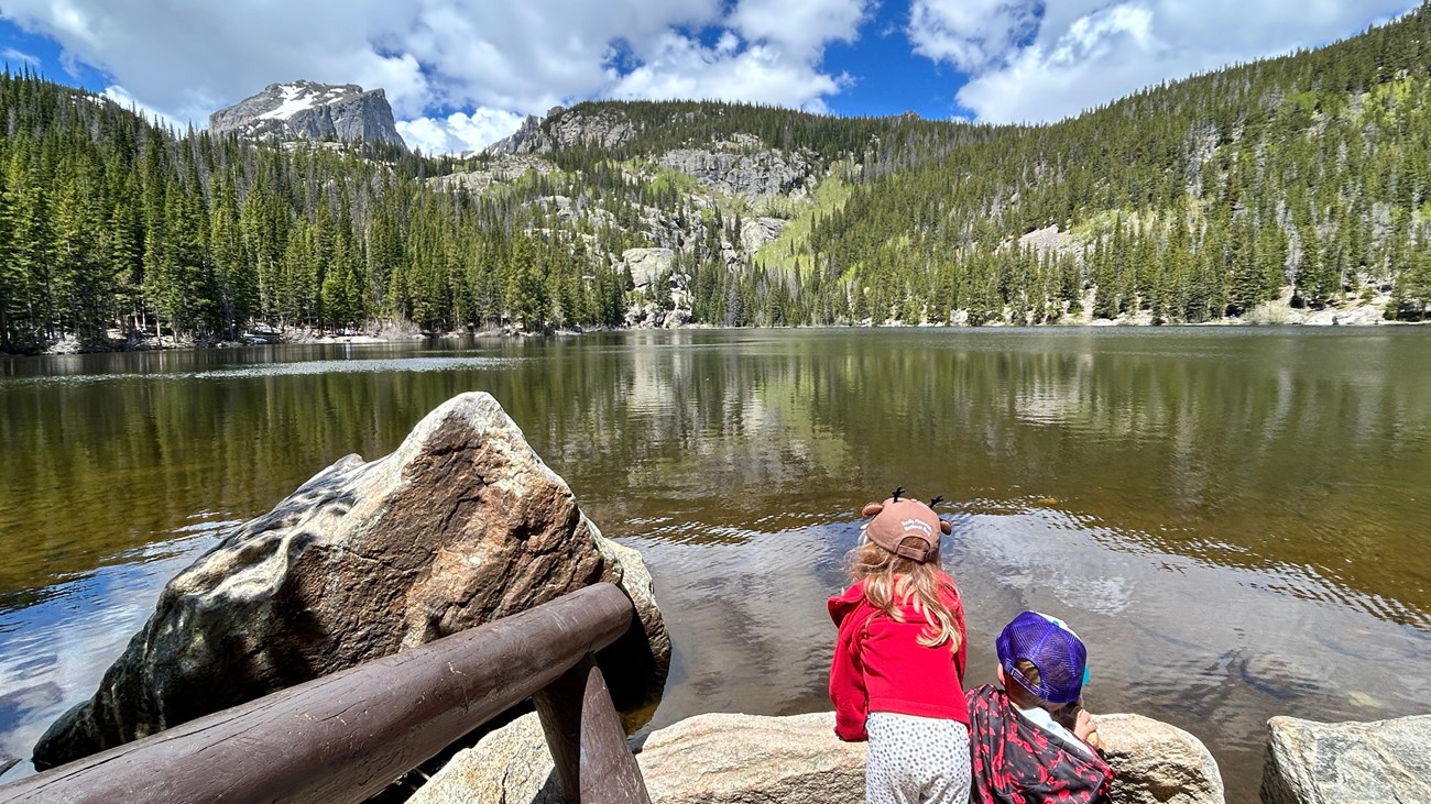Two Junior Rangers are gazing out at Bear Lake