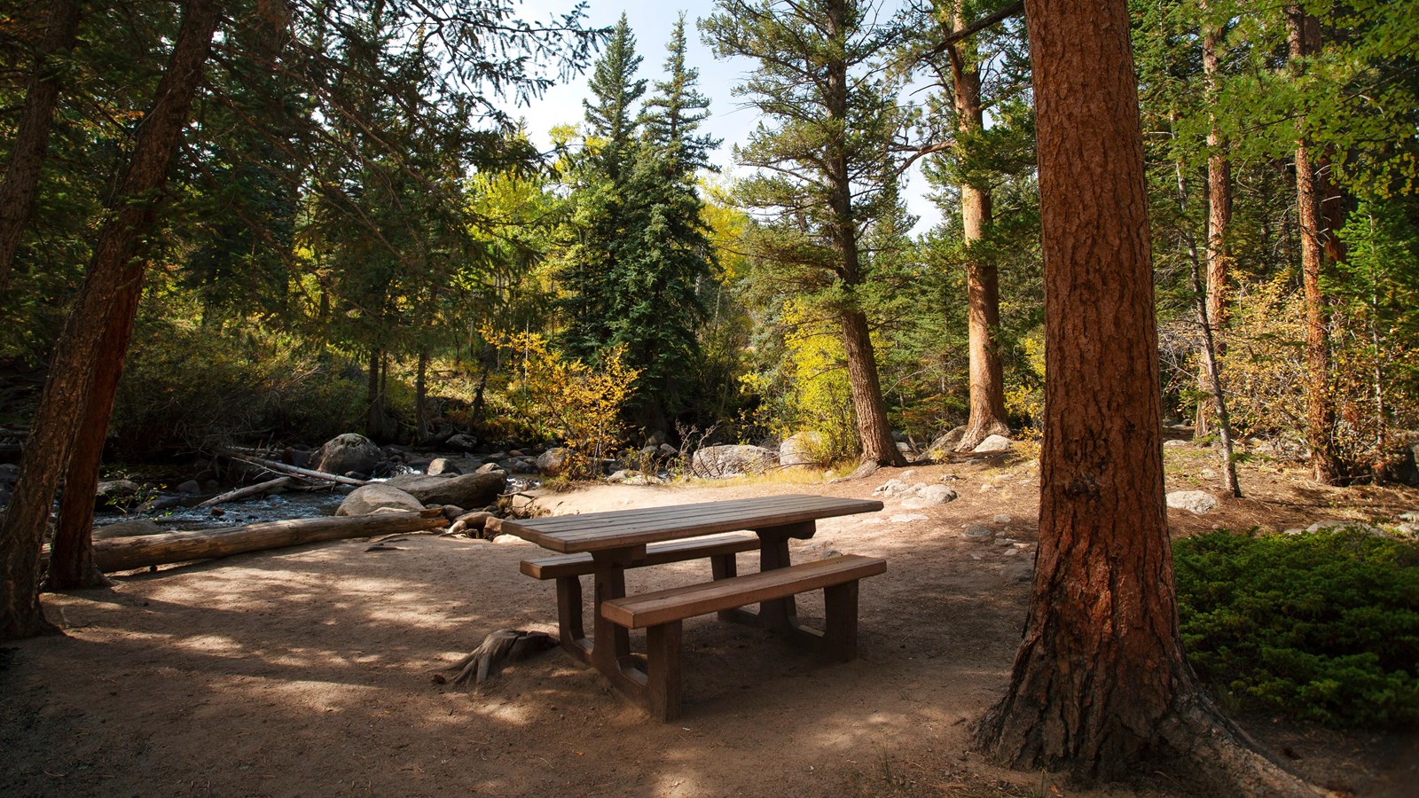picnic table by a river