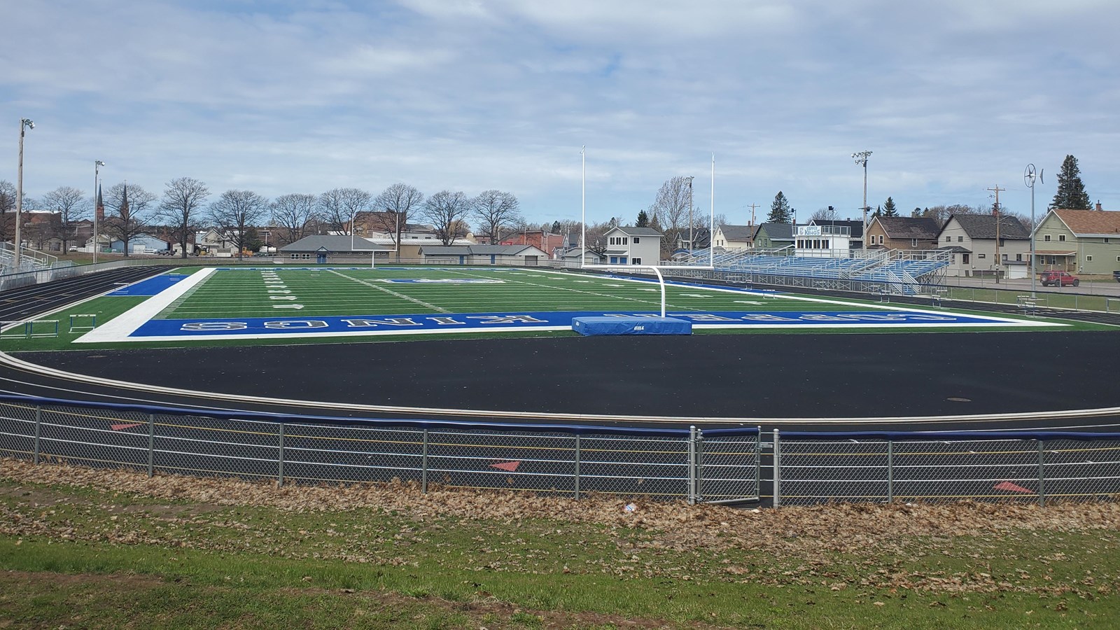 Spring picture of open field area with small football pitch.