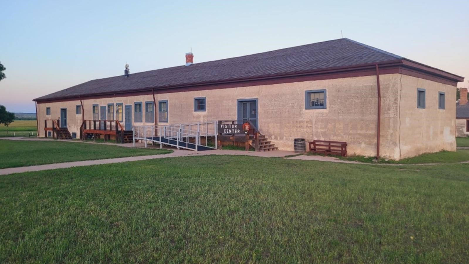 Commissary Storehouse a brown adobe building with blue trim and blue doors