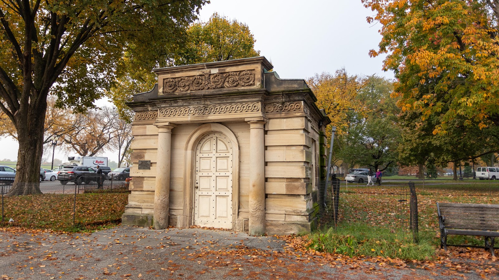 A small stone building with one door.