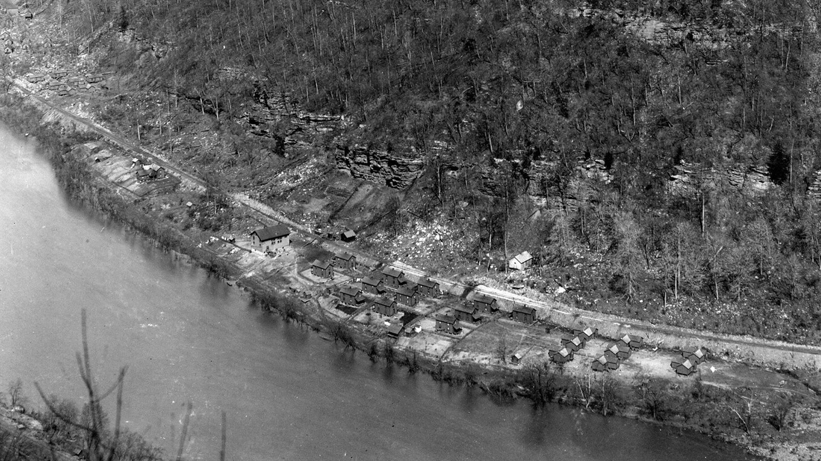 Historical photo of the Red Ash community from above showing the river and the railroad tracks. 