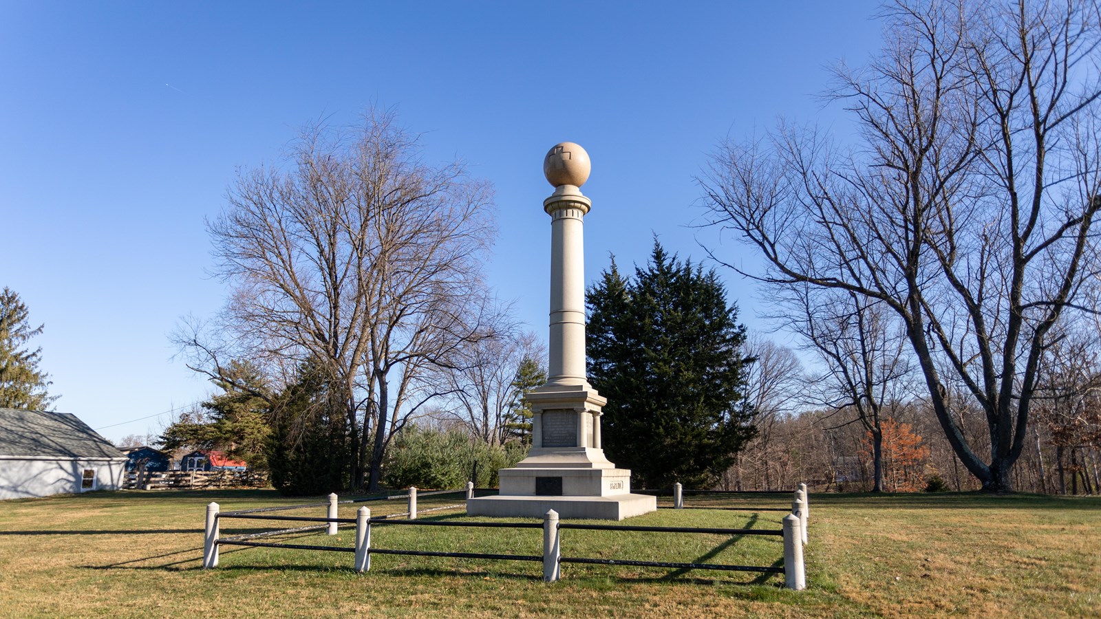 A large white pillar with a circular top. 