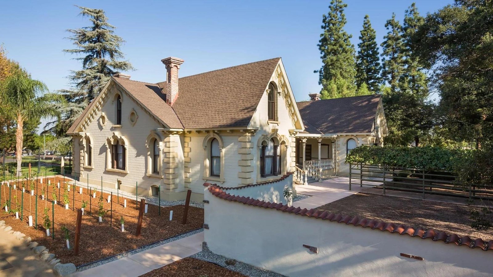 A historic, small cottage with a pitched roof.