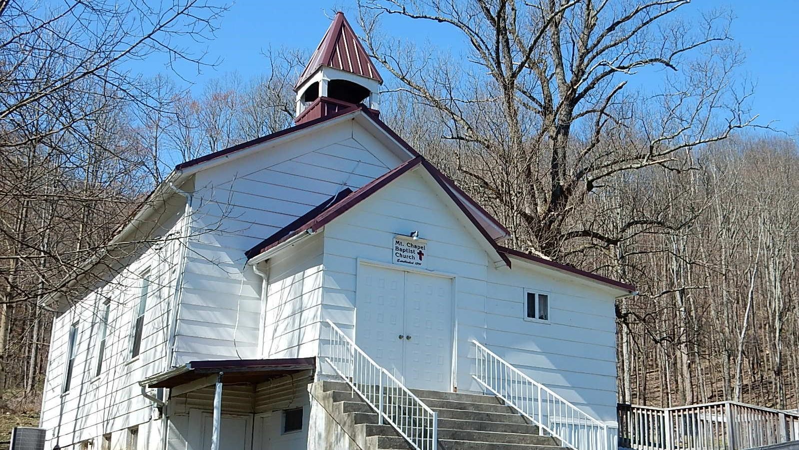 A white church with purple trim