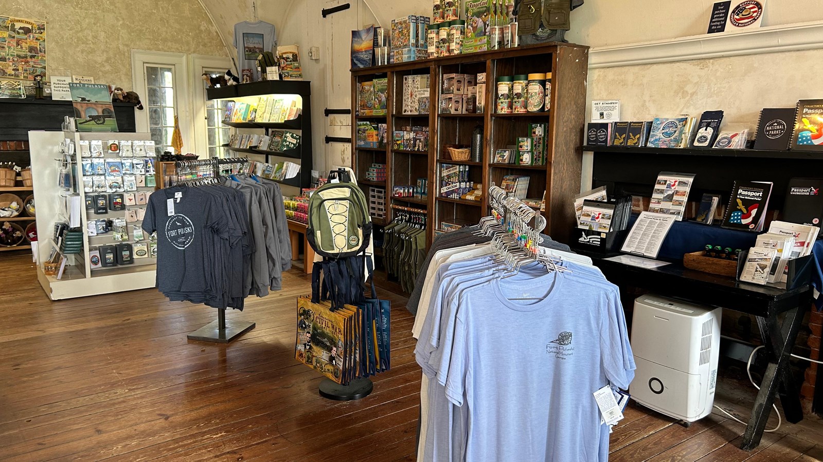 A store with t-shirts and various items on display. 