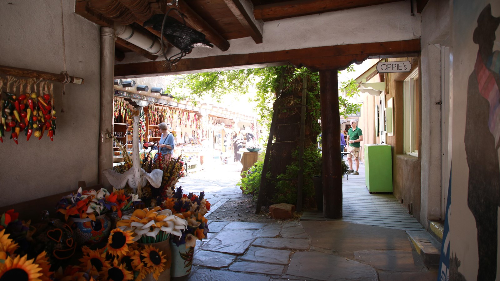 Looking down a corridor, into an open plaza.