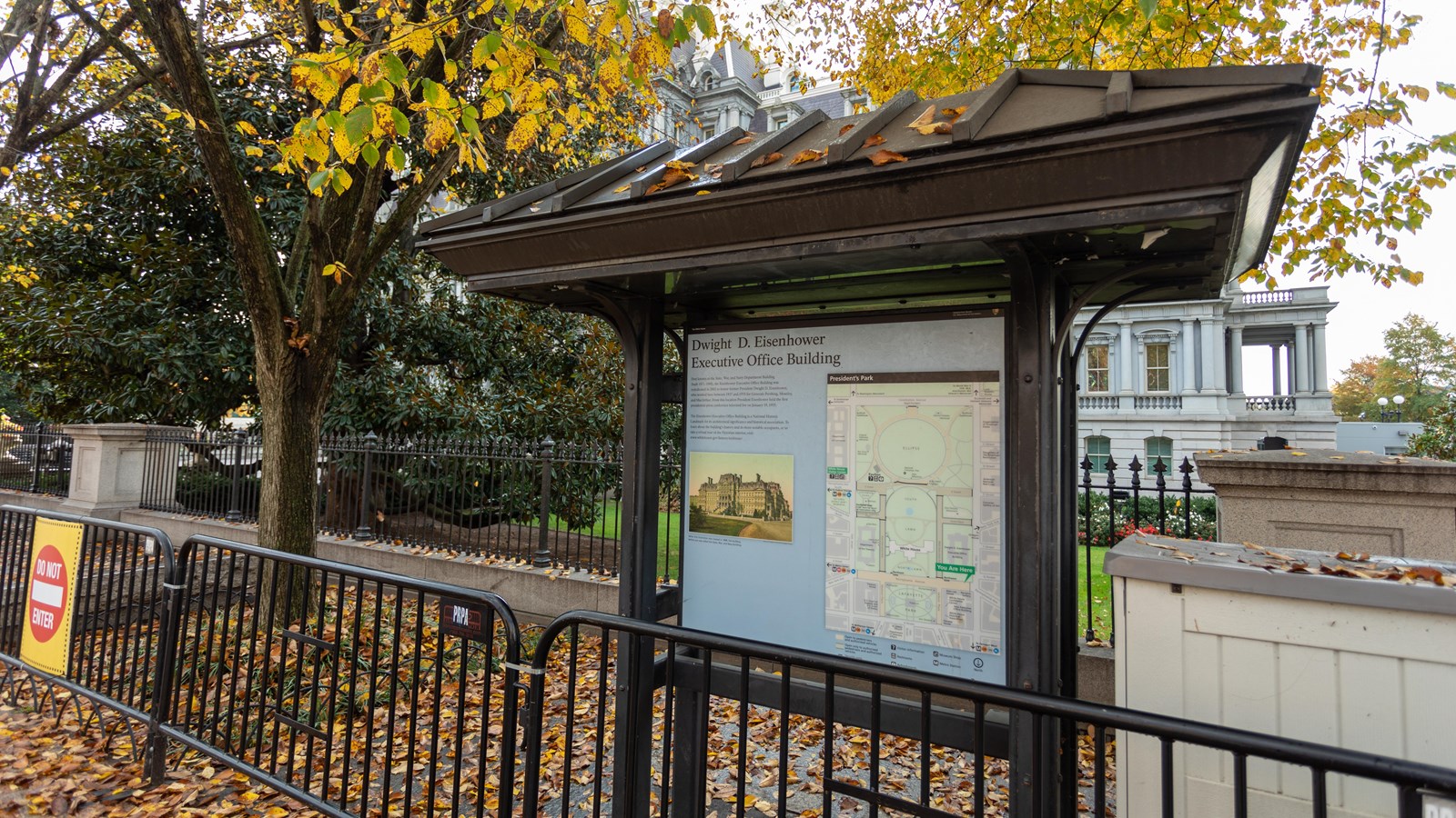 An interpretive panel describes the Dwight D. Eisenhower Executive Office Building.