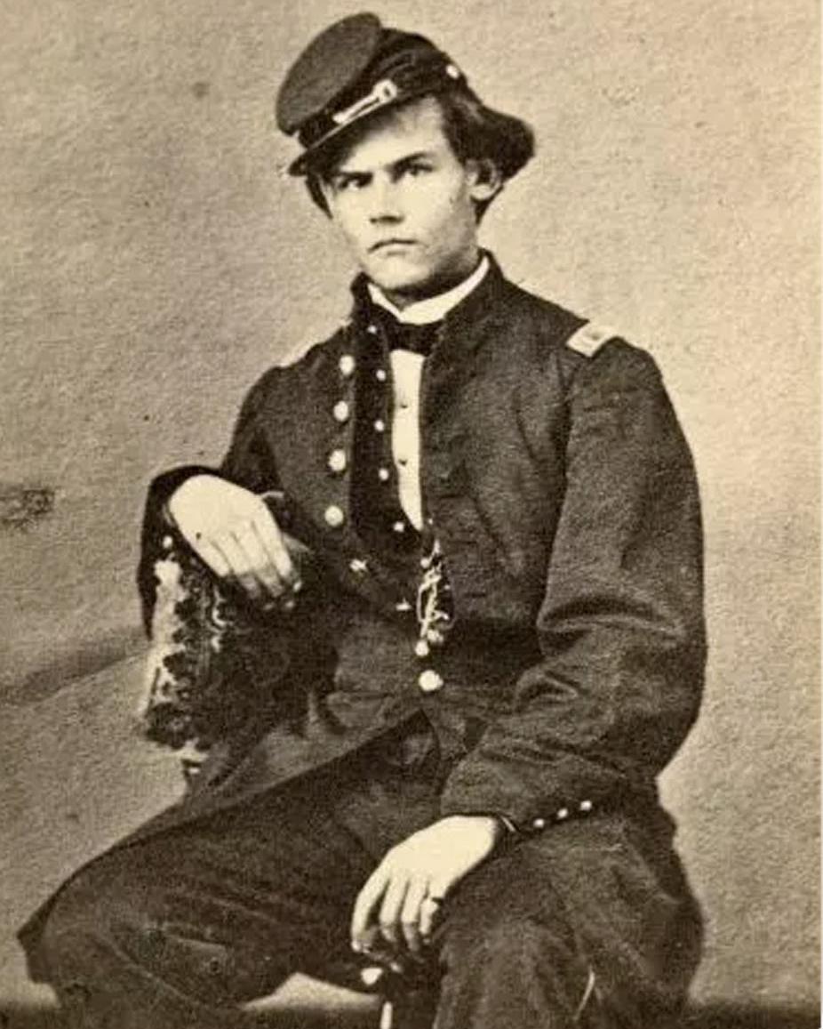 An aged photograph of a young man in a Civil War US Army uniform.