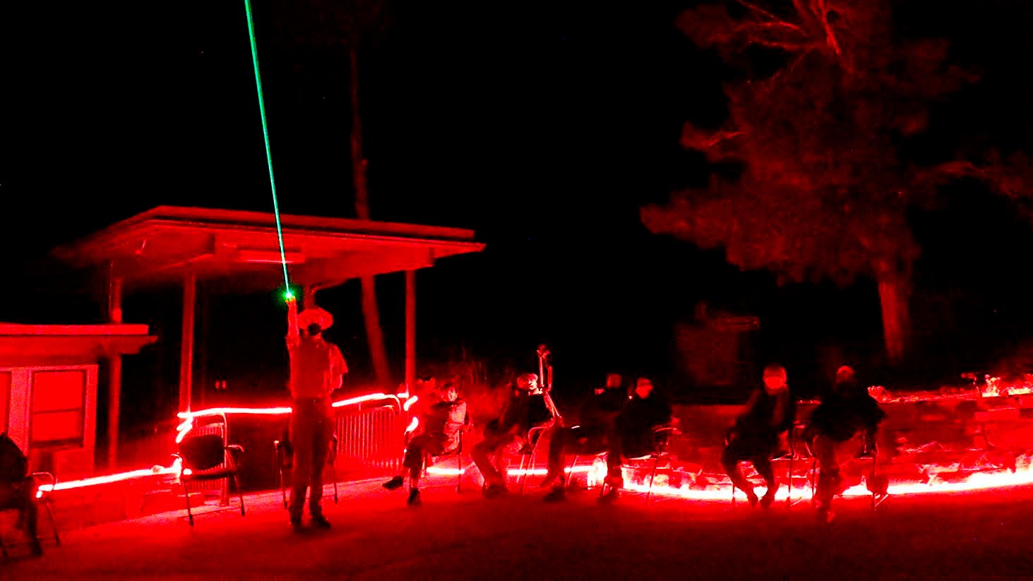 Red lit ranger program with ranger using green laser pointer.