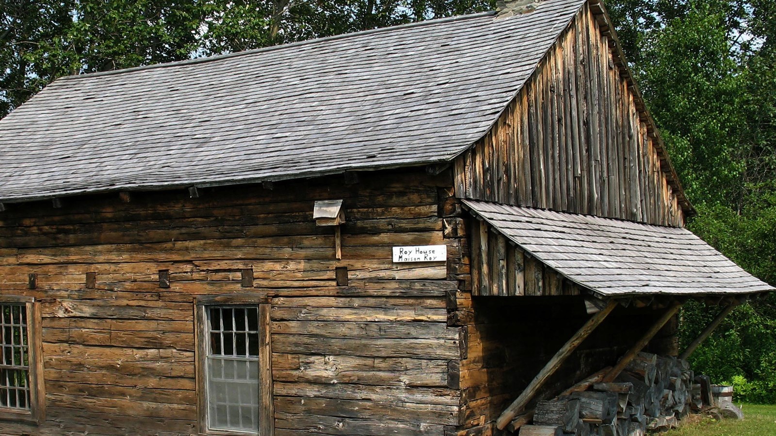 A wooden house built of stacked hewn logs.