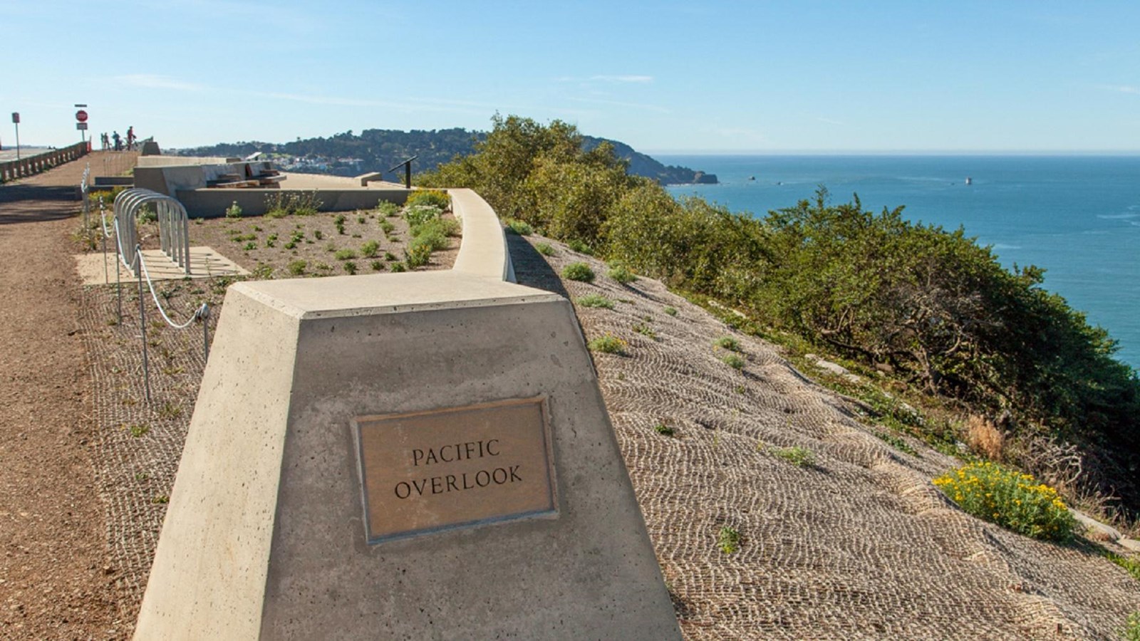 Plaque marking the Pacific Overlook. In the distance, the Pacific Ocean is in view