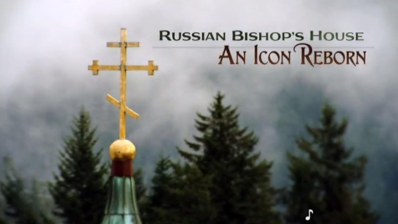 Movie title with Russian Orthodox cross on a steeple and mist-shrouded forest in the background