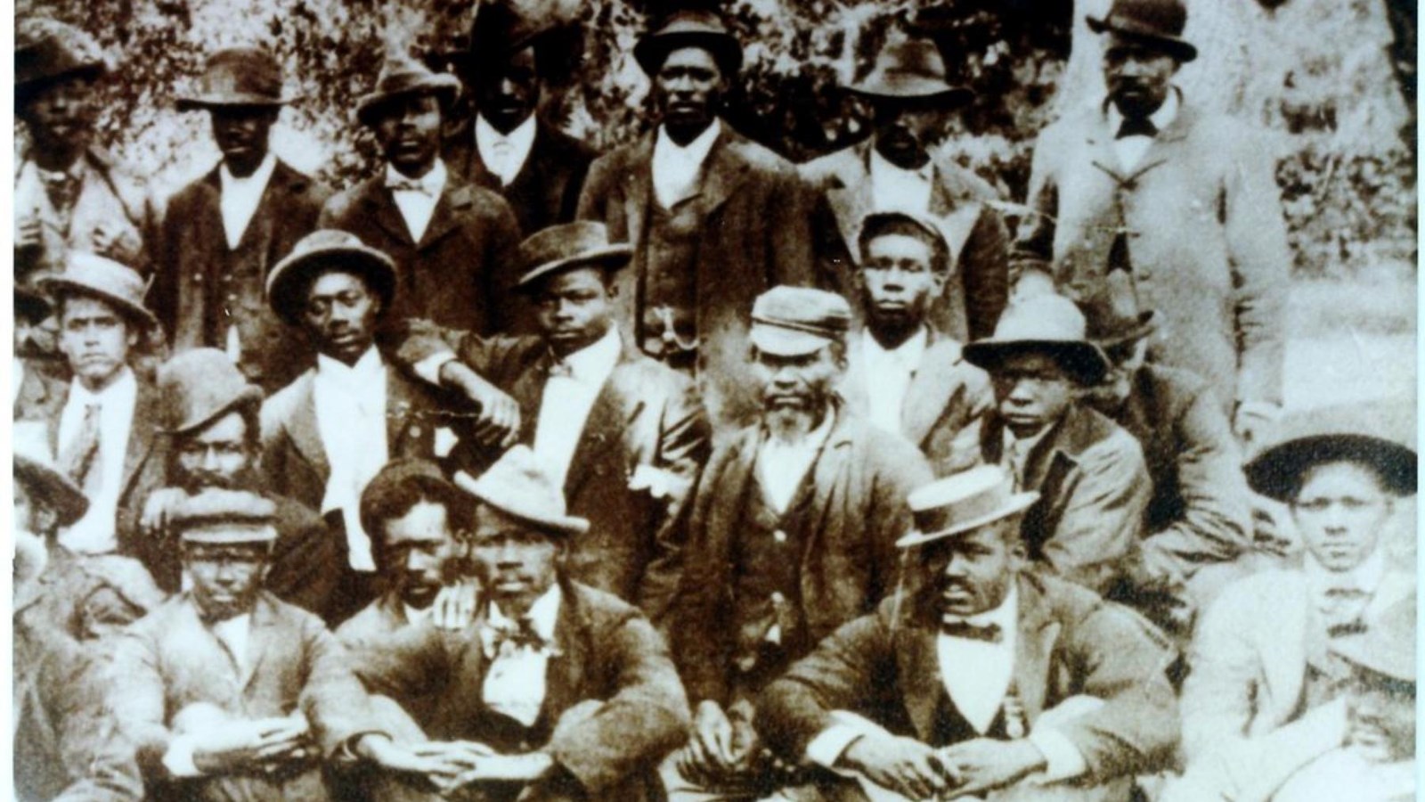 Black and white photo of Carnegie employees posing for a portait