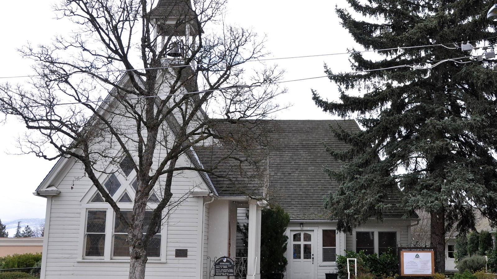 Photo of church with spire. 