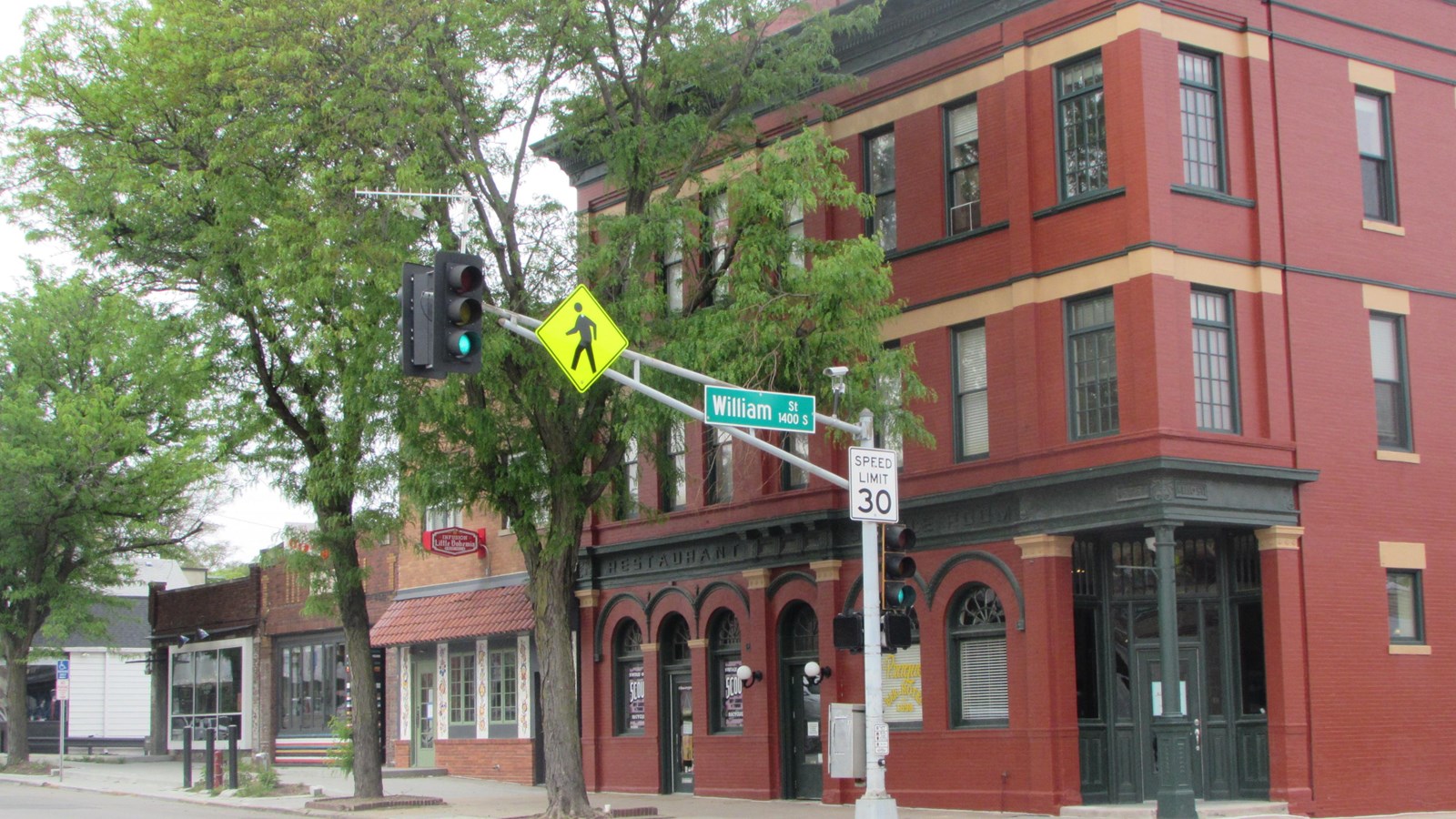 Three story brick hotel, two story commercial building, two one-story commercial buildings