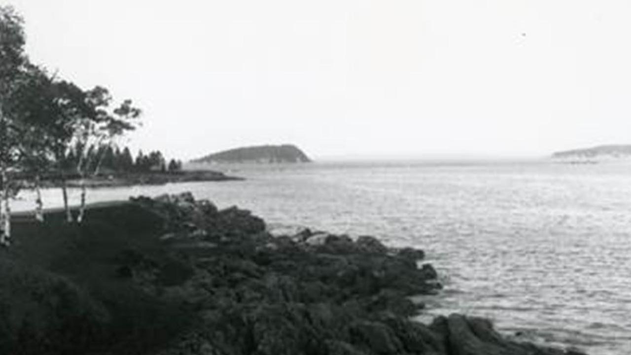 A rocky outcrop into the water.