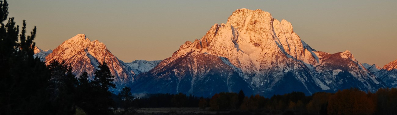 A river with mountains in the background.