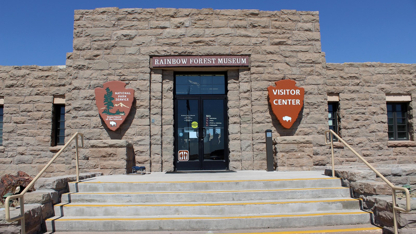 Stone building against a blue sky.
