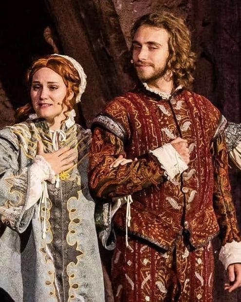 A man and woman in Elizabethan clothing