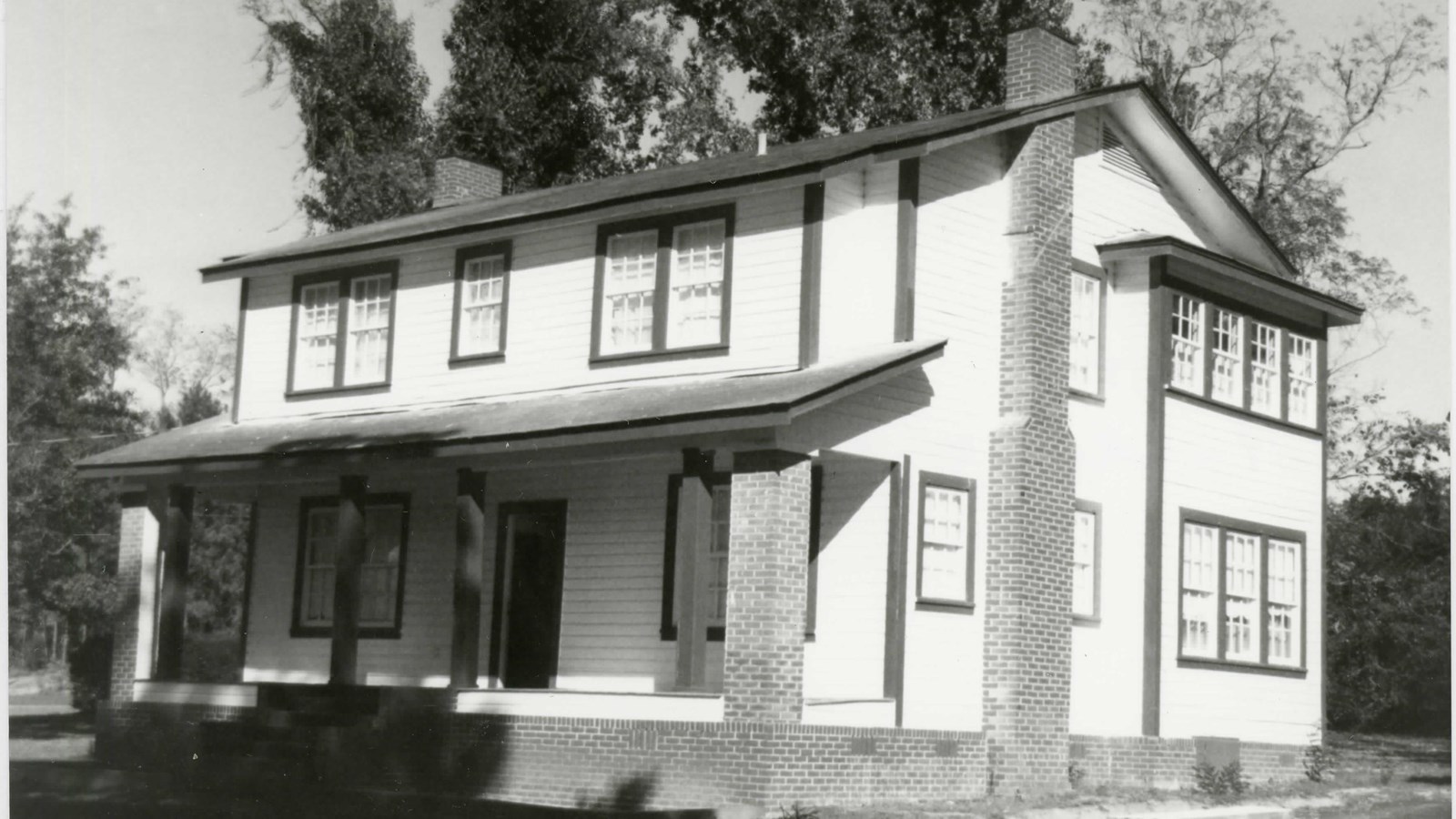 Two story house with front porch and two chimneys