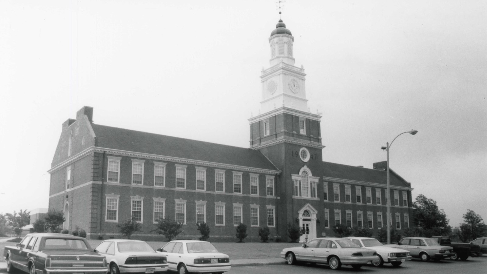 Large brick academic building with central tower