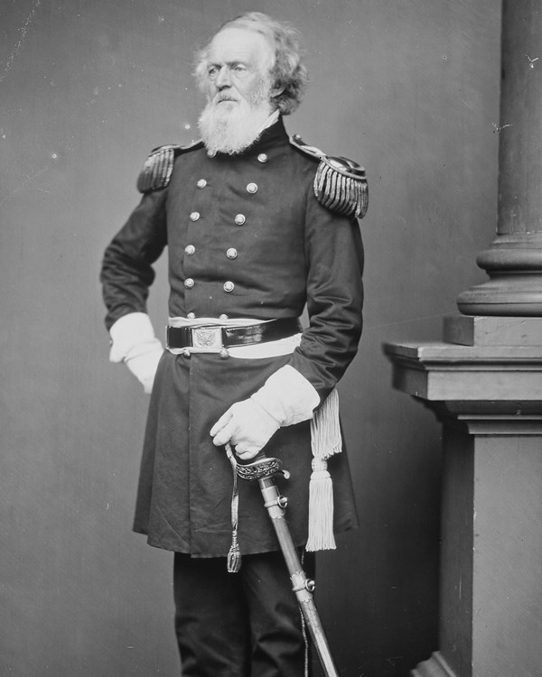 Black and white image of a older man with a long beard in a Civil War era uniform.