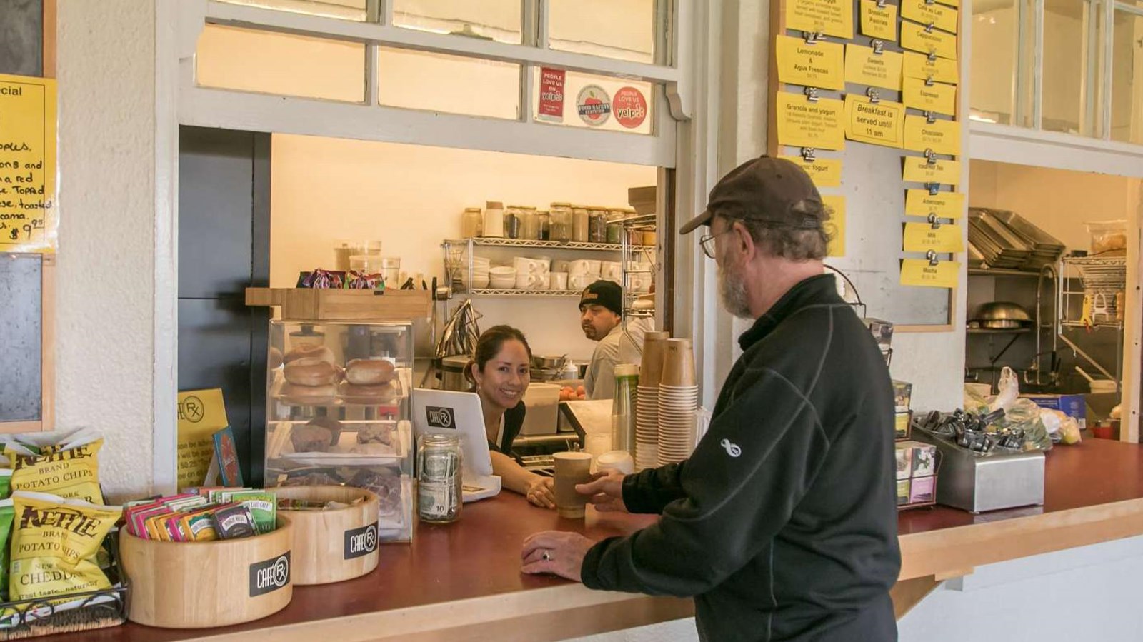A customer orders lunch at the café counter.