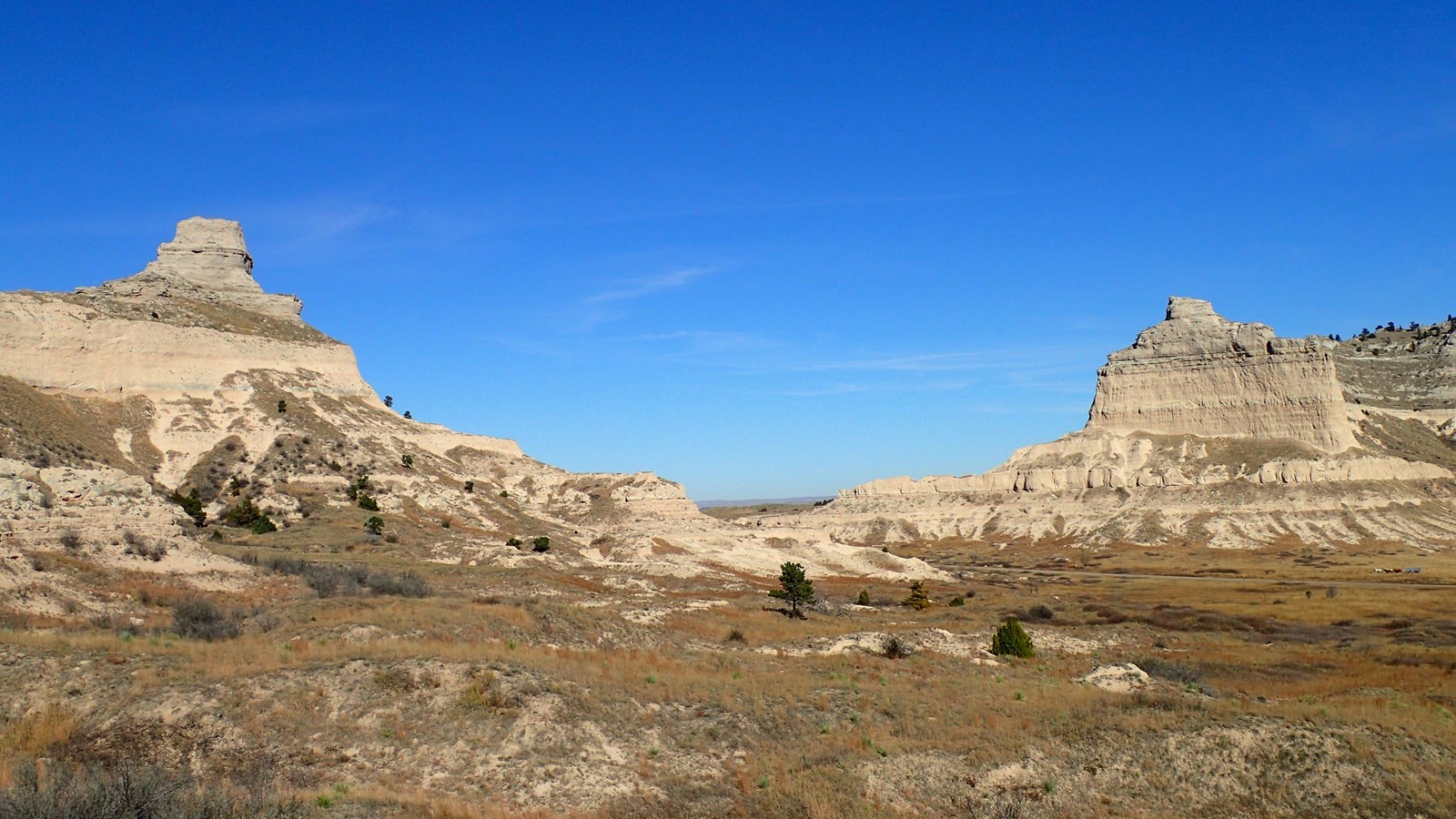 A prominent gap between steep sided sandstone bluffs. 